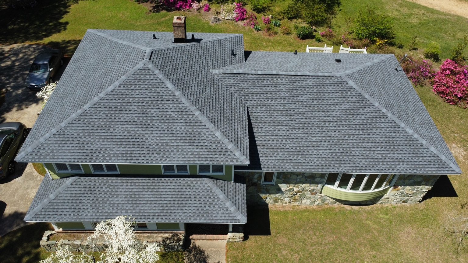 Aerial view of a completed gray architectural shingle roof replacement